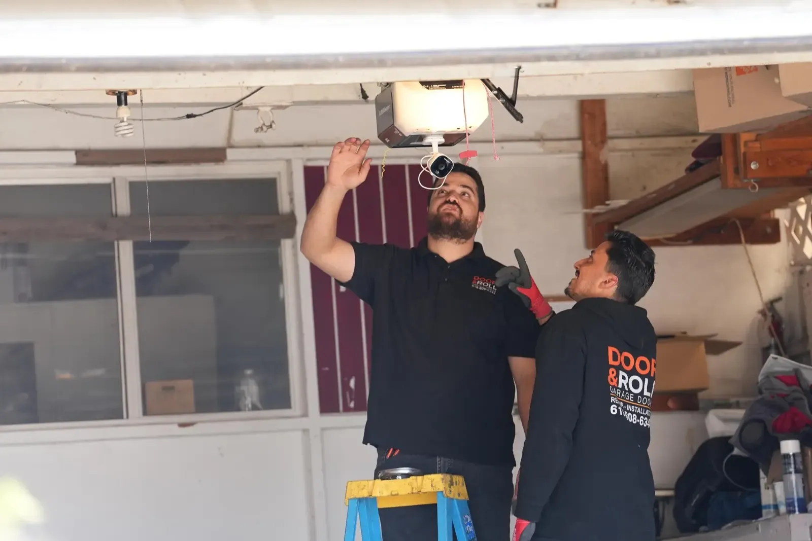 Door & Roll Garage Door technicians installing a garage door opener in San Diego